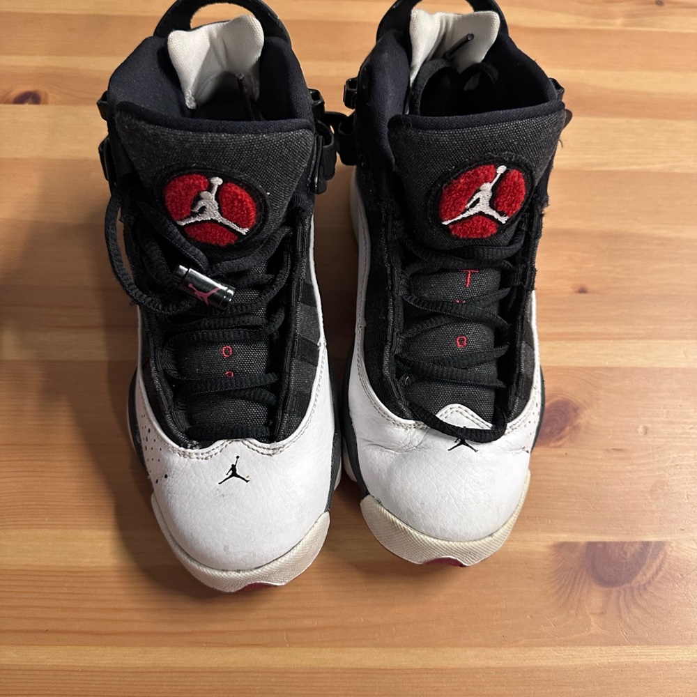 Black and White Sneakers with Red Accents use